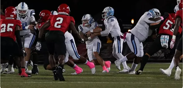 College football players in action during a game